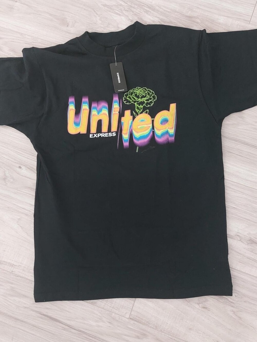 Express Black Tee with Rainbow 'United' Graphic and Neon Green Flower